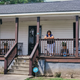Linda Worsley stands on the porch of her parents’ home in Princeville, North Carolina.
